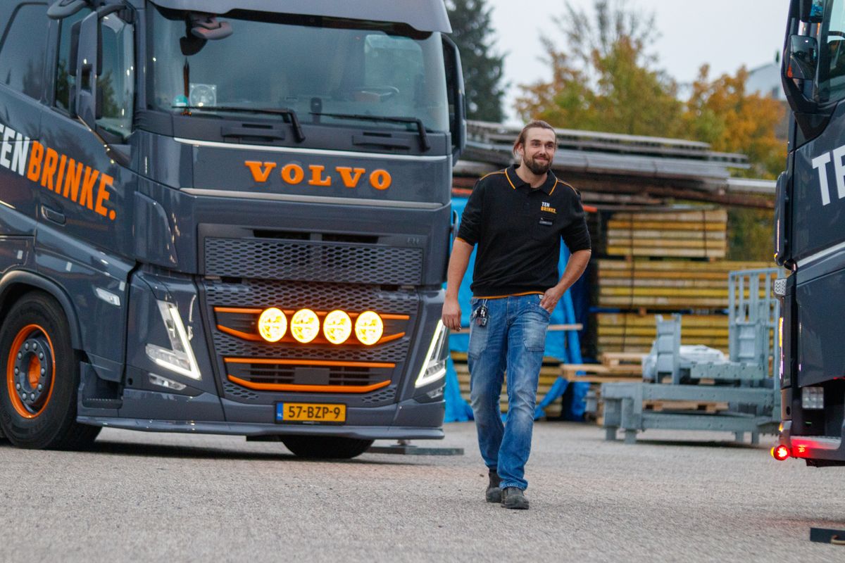 Truck driver next to a Volvo truck